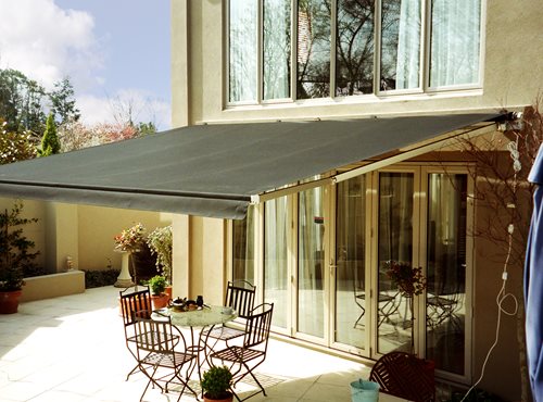 Euro Retractable awning open over backdoor and sitting area