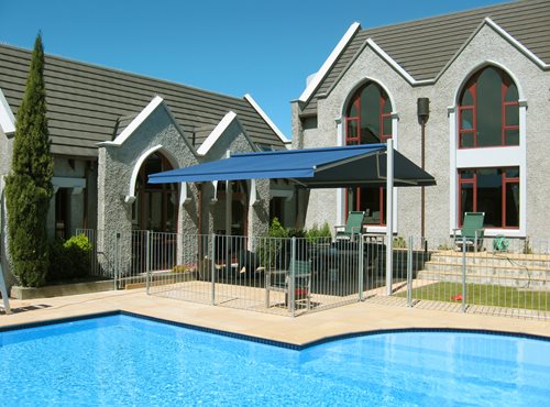 Outdoor canopy over sitting area beside pool
